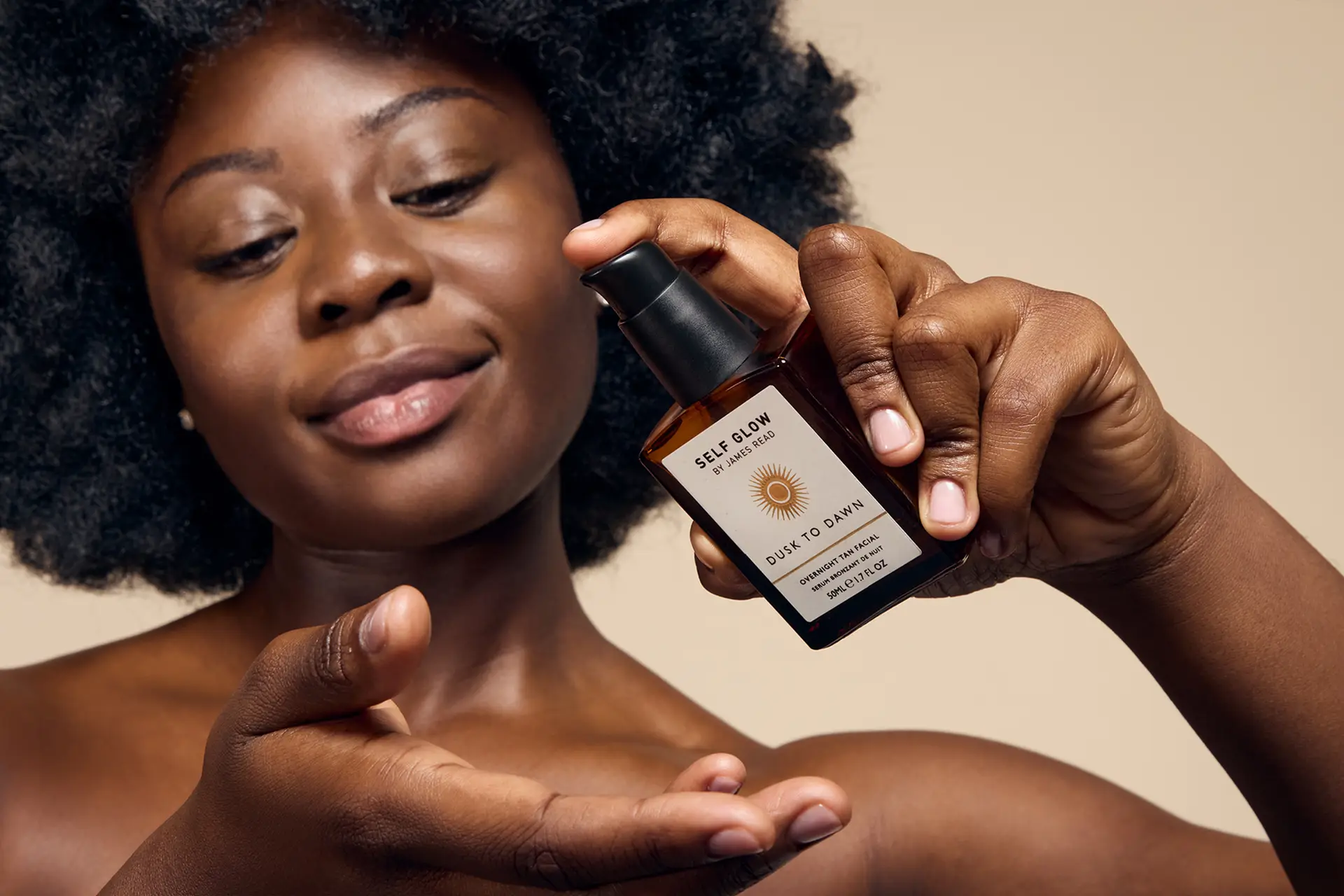 Campaign image by Saltco showing model mid-application of Self Glow ‘Dusk to Dawn’ overnight facial serum