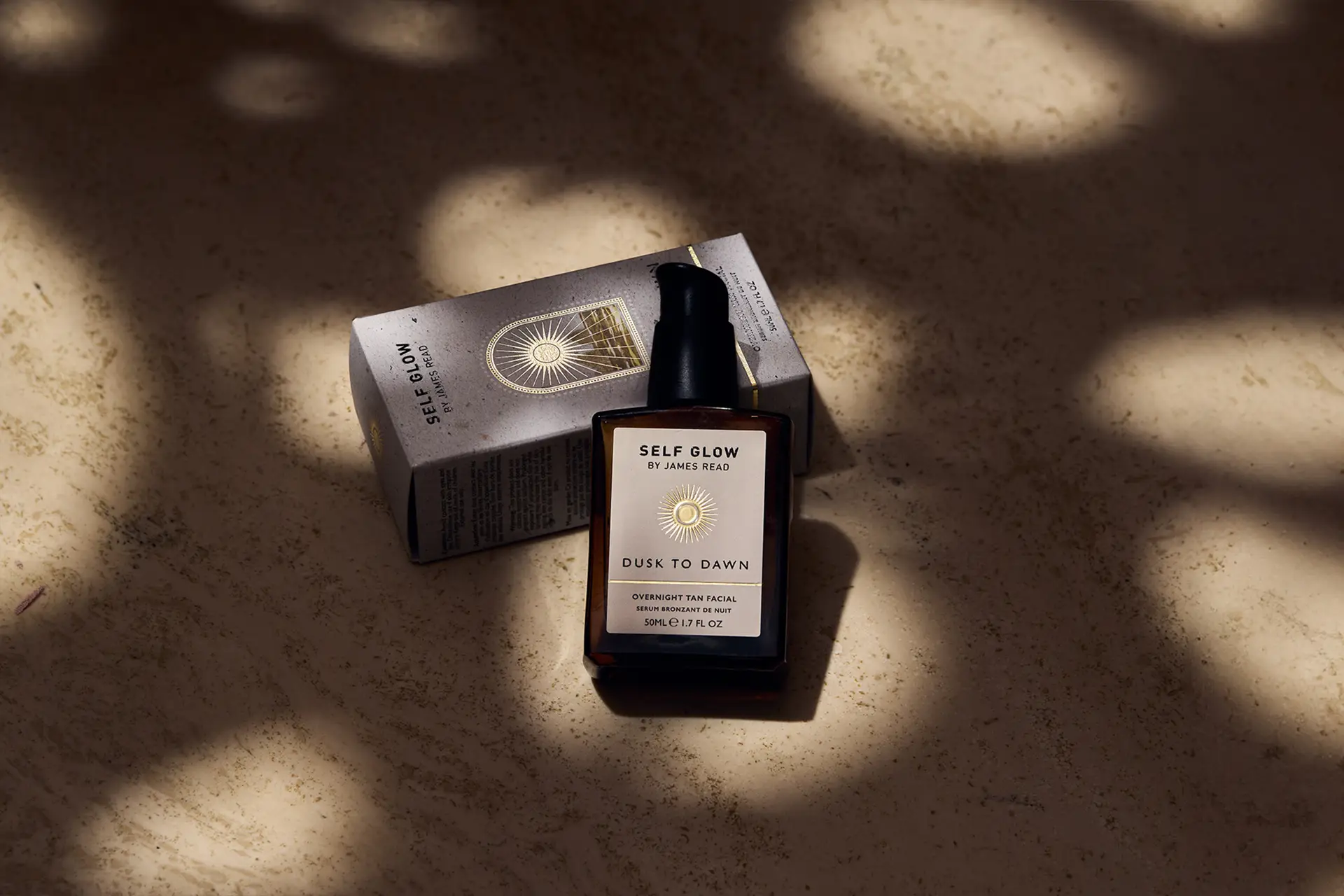 Premium packaging design and creative product shot by Saltco for Self Glow’s ‘Dusk to Dawn’ overnight tan facial, featuring bottle and carton in sculpted shadows