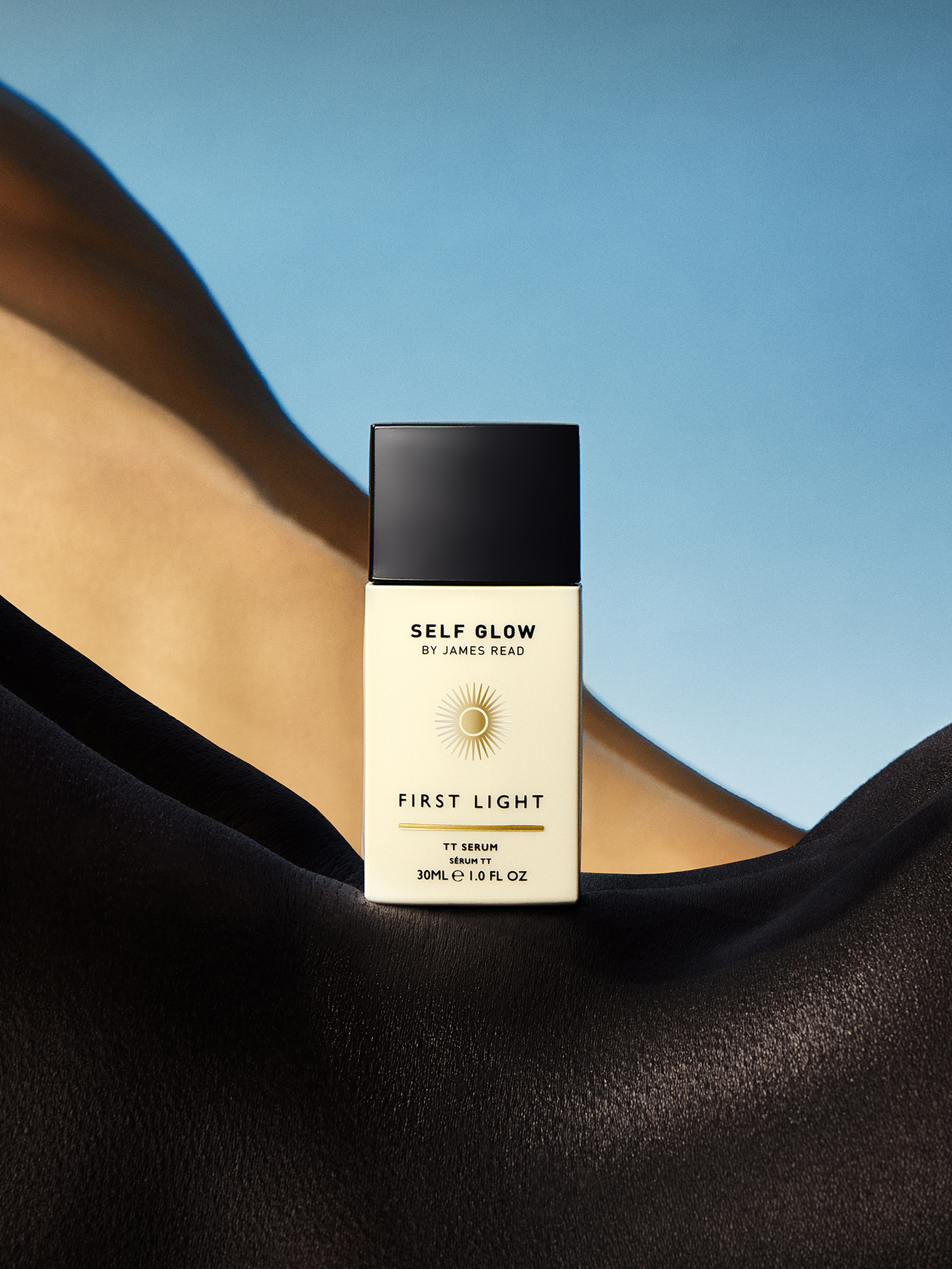 Creative direction by Saltco for Self Glow’s ‘First Light’ serum; product shown resting between two models’ backs shaped to resemble a sculptural landscape