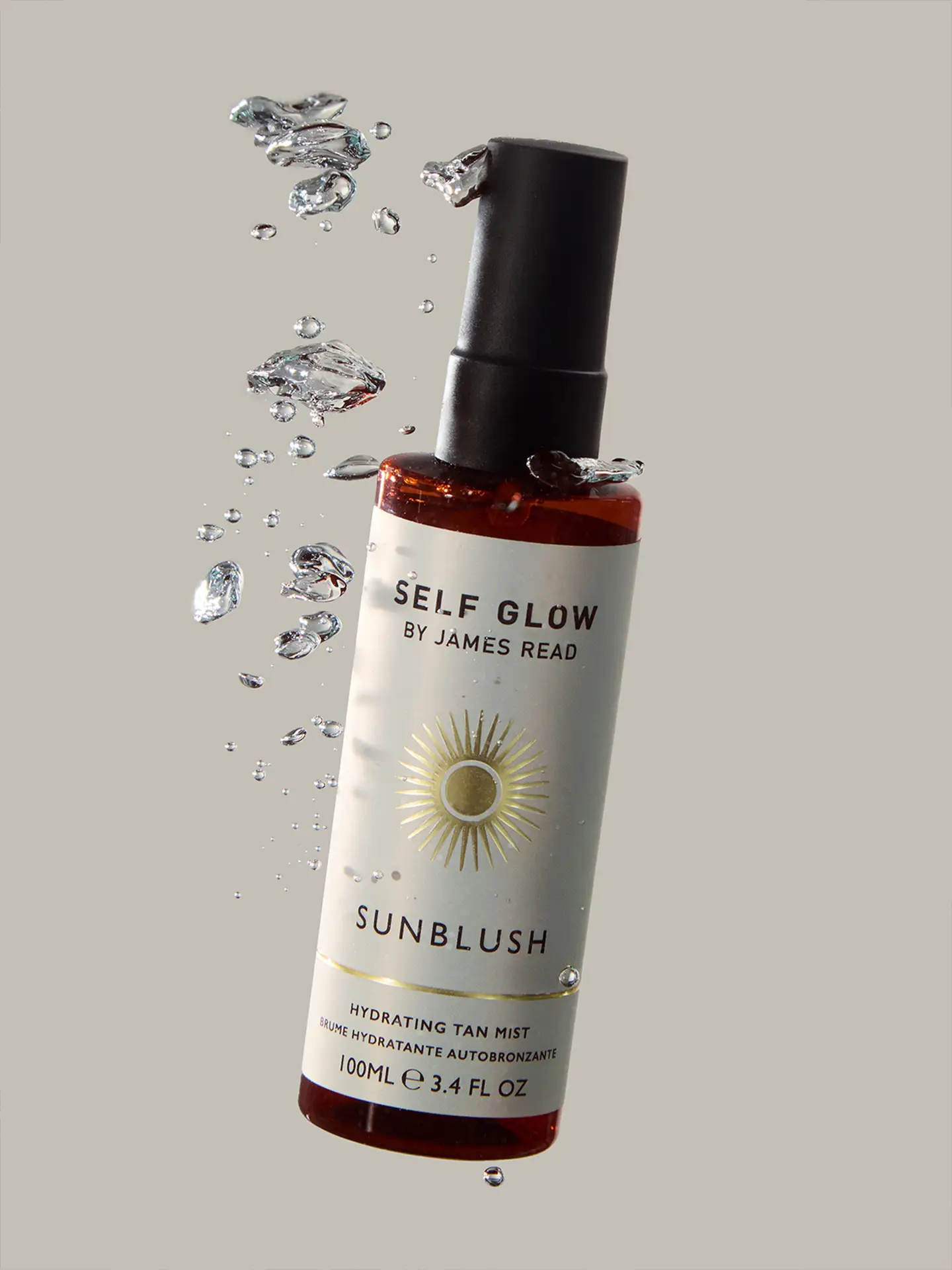 Creative campaign product image by Saltco for Self Glow’s ‘Sunblush’ tan mist, shown with suspended water droplets to highlight hydration